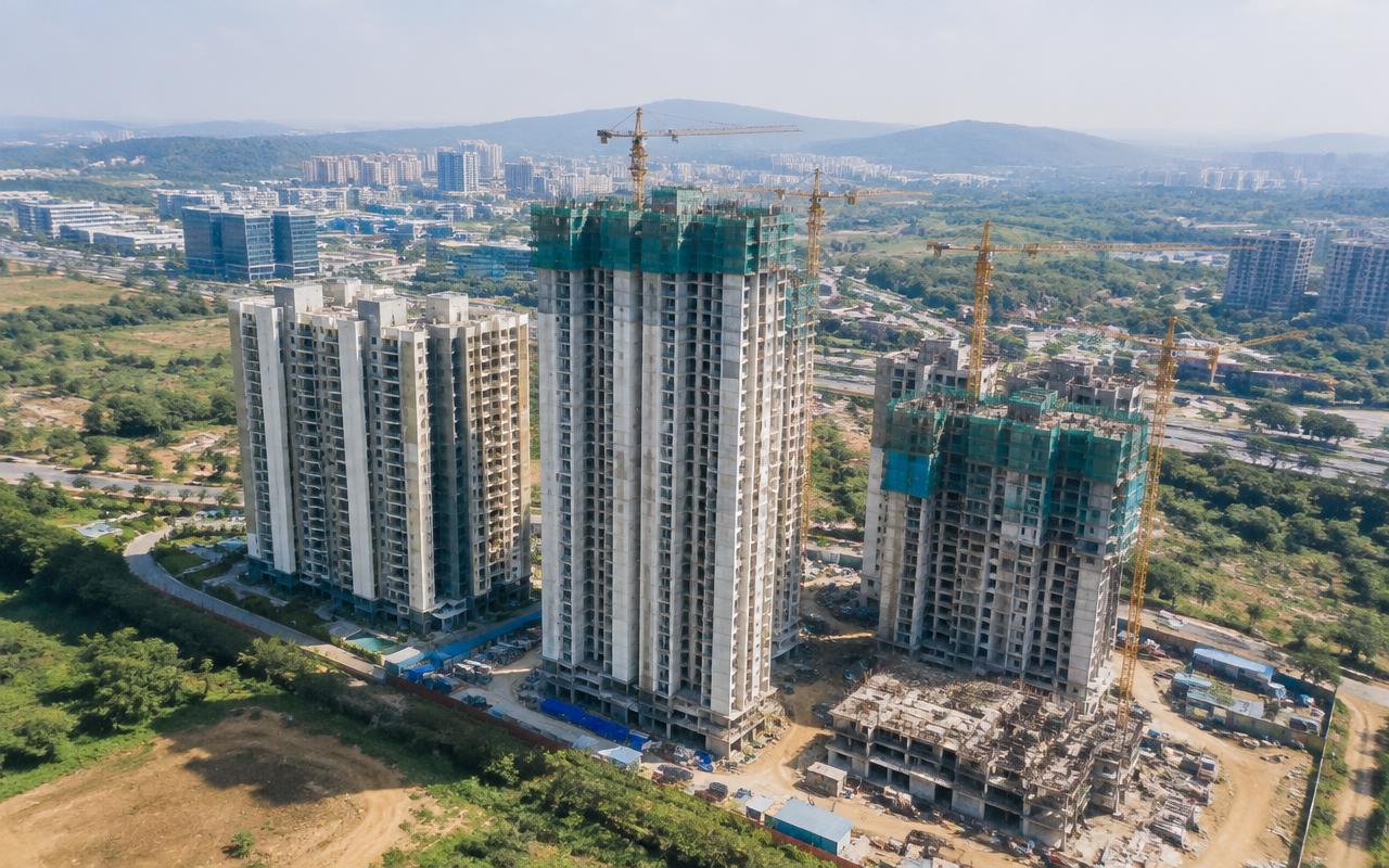 Aerial view of residential towers rising with cranes in Hinjewadi, Pune — Moshi